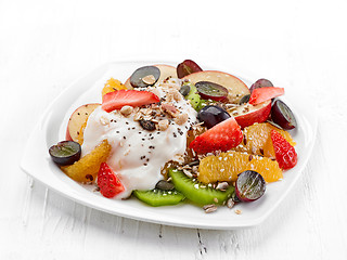 Image showing fruit and berry salad on white plate