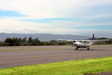 Image showing Small airplane in mountains