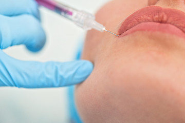 Image showing woman gets injection in her lips