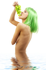 Image showing green hair girl with a bunch of grapes in water