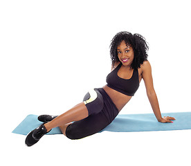 Image showing Pretty African American girl sitting on floor.