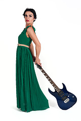 Image showing Pretty woman in long dress with guitar