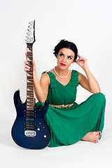 Image showing Pretty woman in greek style dress with guitar