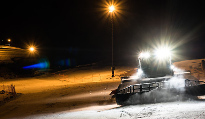 Image showing Snowcat preparing a slope at night 