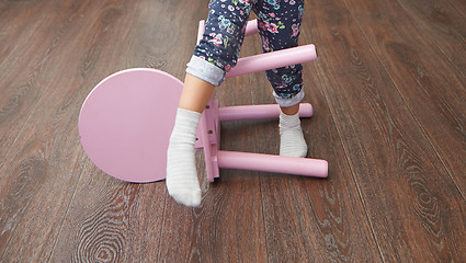 Image showing Child overstepping chair