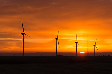 Image showing Bright Orange Sunrise Signal Peak Wind Turbines Washington Green