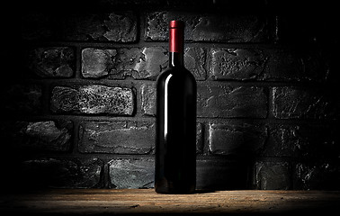 Image showing Wine and wall of bricks