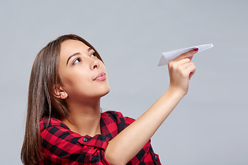 Image showing Dreamy female holding white paper plane