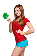 Image showing Happy teenager holding shamrock leaf