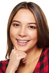 Image showing Teen female smiling with braces on her teeth