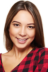 Image showing Teen female smiling with braces on her teeth