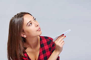 Image showing Dreamy female holding white paper plane