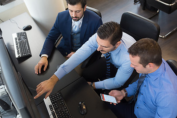 Image showing Business team analyzing data on computer.