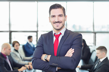 Image showing Team leader with coworkers working in office.