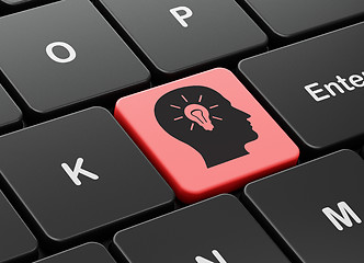 Image showing Finance concept: Head With Light Bulb on computer keyboard background