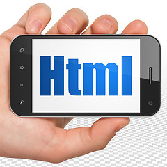 Image showing Software concept: Hand Holding Smartphone with Html on display