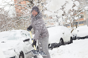 Image showing Man shoveling snow in winter.