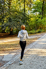 Image showing Anorexic woman running in park