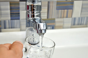 Image showing Filling glass of water from  kitchen faucet