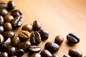 Image showing Coffee bean on wooden table