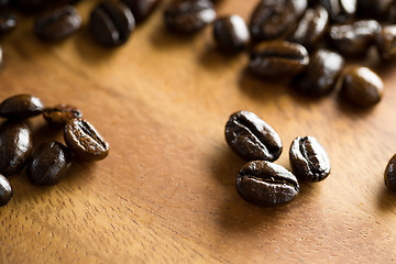 Image showing Close up of Coffee bean on wooden table