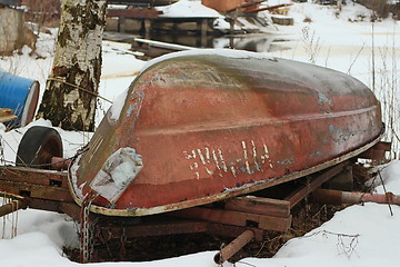 Image showing  old rowing boat laying on the shore