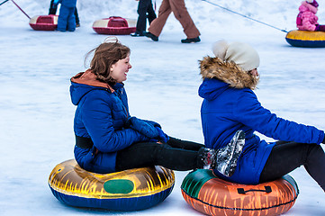 Image showing Baby winter sledding on the Ural River