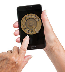 Image showing Senior woman hand with smart phone isolated, old fashion dial