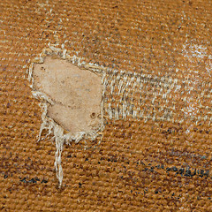 Image showing Detail (damage) of an old canvas suitcase, close-up