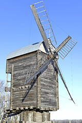 Image showing Old wooden windmill close up in winter