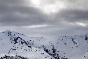 Image showing Snowy mountains and gray sky before blizzard