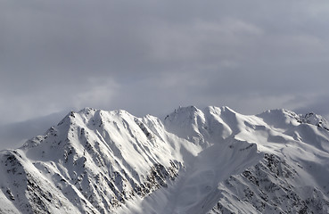 Image showing Evening sunlight mountains and gray sky