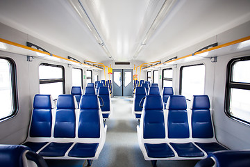 Image showing Rows of seats in a passenger train carriage