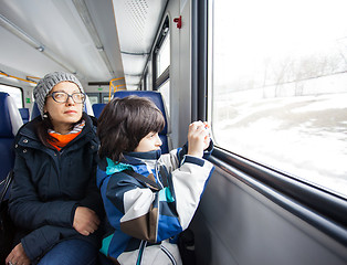 Image showing Mother and son in a railway carriage