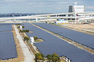 Image showing Solar panels in industrial city