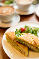 Image showing Breakfast with coffee and panini