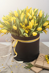 Image showing Bright spring bouquet of tulips and mimosa flowers