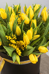 Image showing Bright spring bouquet of tulips and mimosa flowers