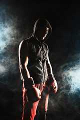 Image showing The young  man kickboxing 