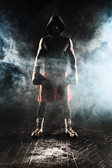 Image showing The young  man kickboxing 