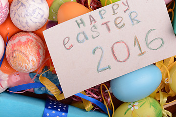 Image showing Easter background with eggs, ribbons and spring decoration