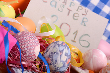 Image showing Easter background with eggs, ribbons and spring decoration