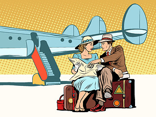 Image showing Tourists couple looking at the map, after landing