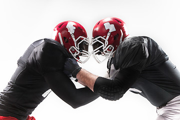 Image showing The two american football players fighting on white background