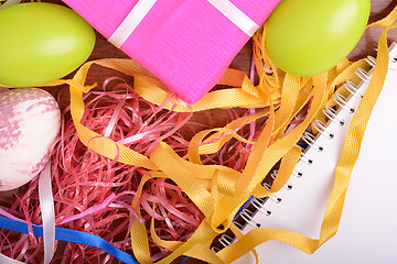 Image showing Easter background with eggs, ribbons and spring decoration