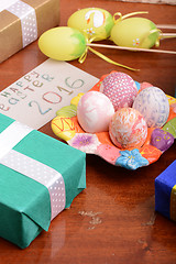Image showing holiday gift box with painted easter eggs