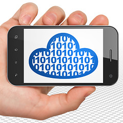 Image showing Cloud networking concept: Hand Holding Smartphone with Cloud With Code on display