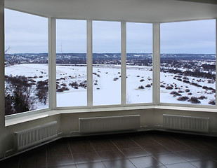 Image showing wide window of verandah with winter landscape