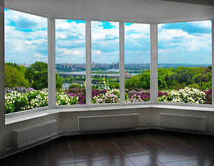 Image showing plastic window with view of Kyiv in spring