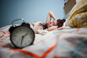 Image showing Woman with insomnia touching her head